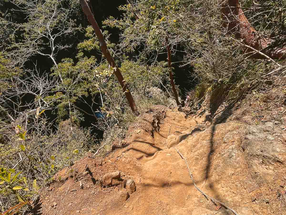 The downhill section of the free route of the Montezuma Waterfalls. This involves holding onto a rope and going down a steep slope.
