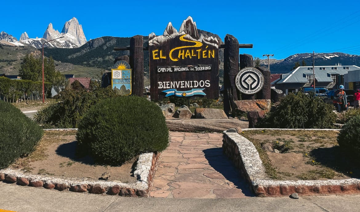 The El Chalten sign at the beginning of town with Mount Fitz Roy in the background.