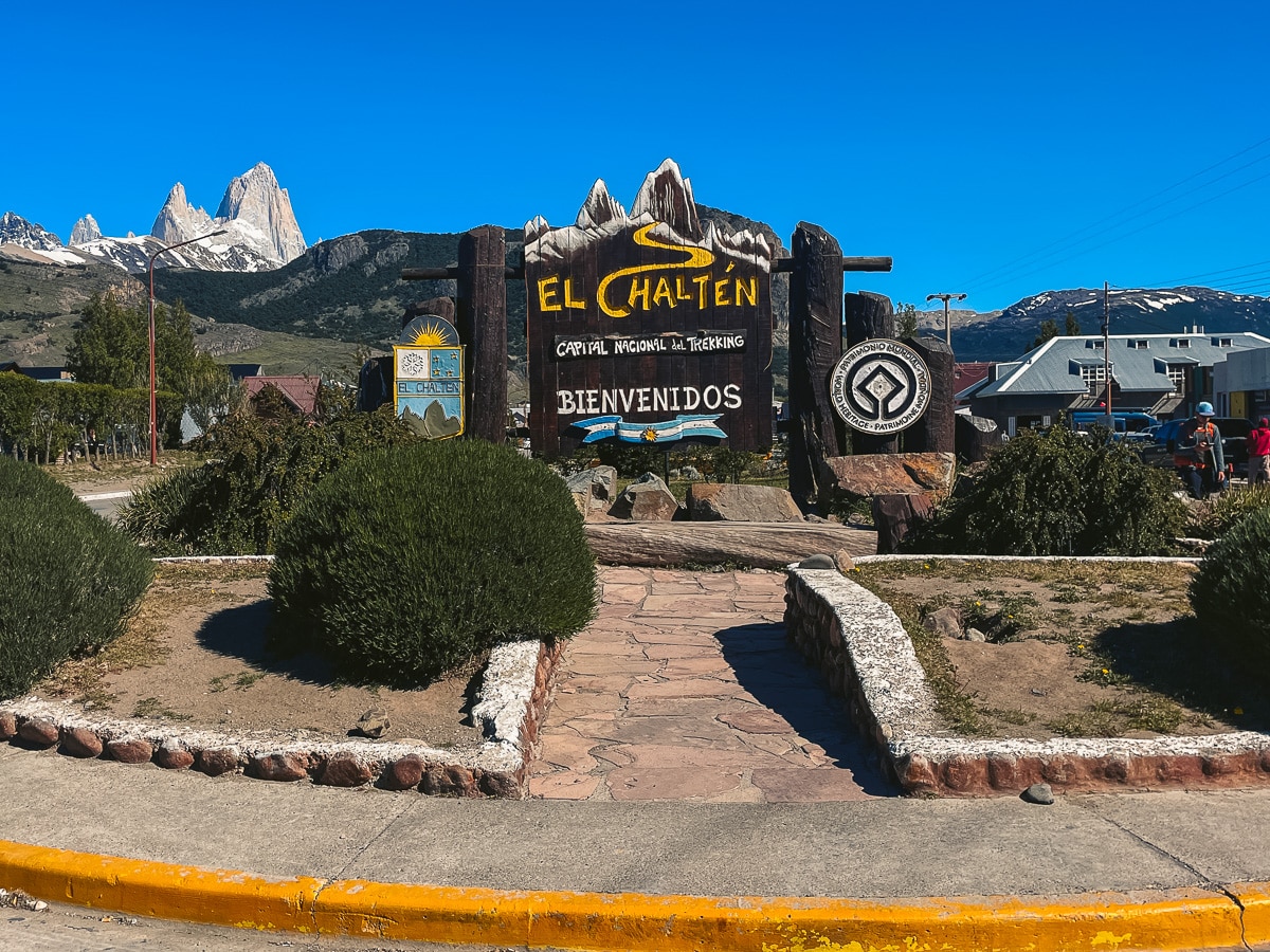 The El Chalten sign at the beginning of town with Mount Fitz Roy in the background.