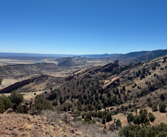 The view from the top of Red Rocks and Morrison slide trail overlooking the red rocks below.