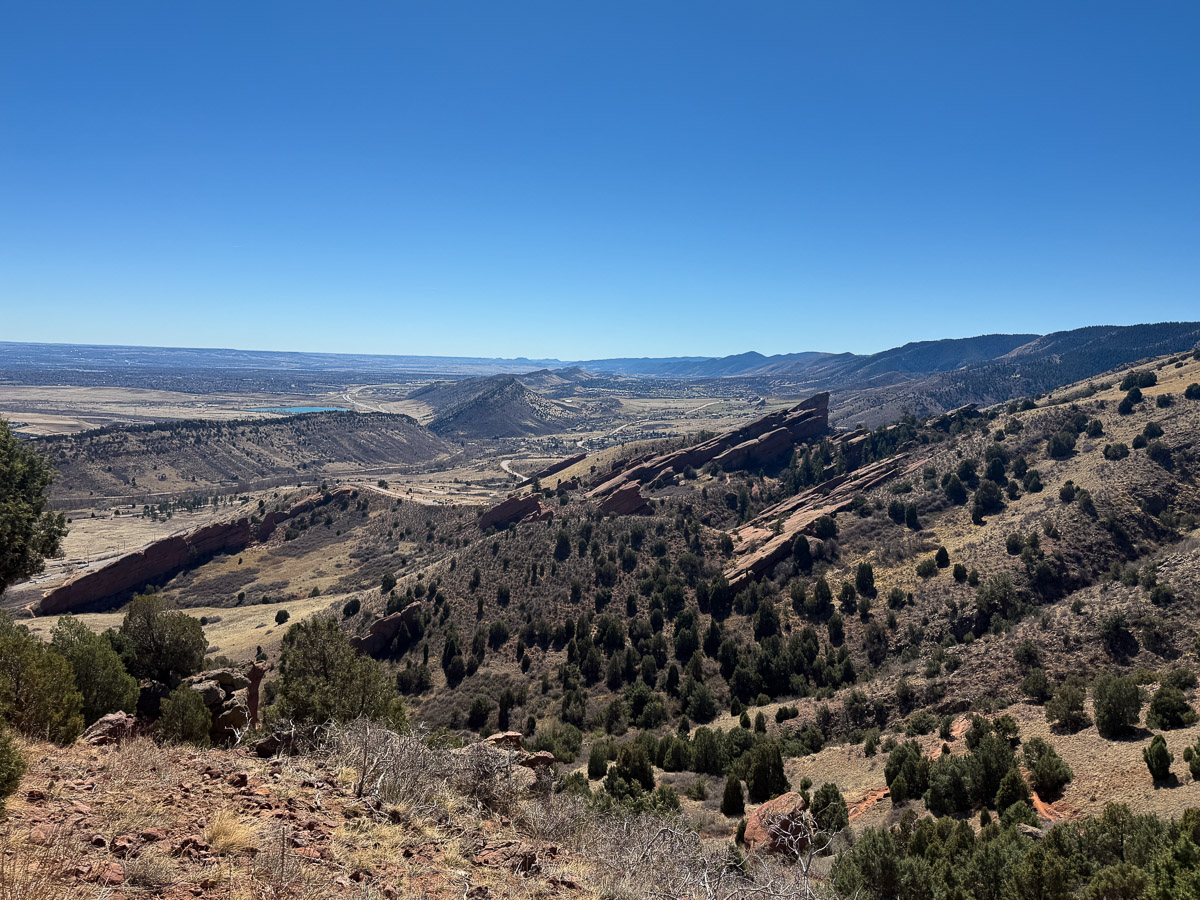 The view from the top of Red Rocks and Morrison slide trail overlooking the red rocks below.